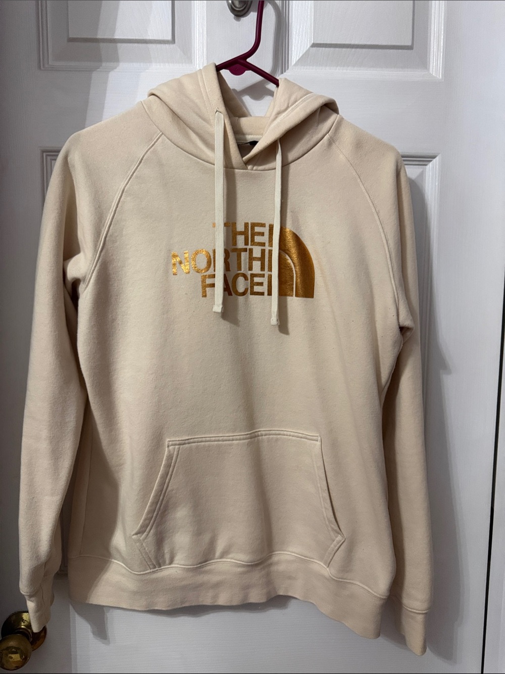 The North Face Women’s Cream Hoodie with Gold Logo